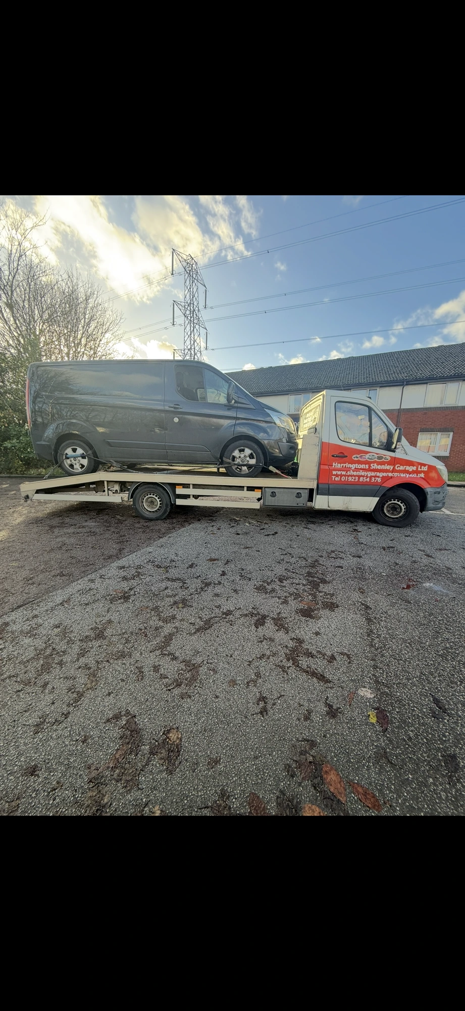 HVT recovery truck loading a van